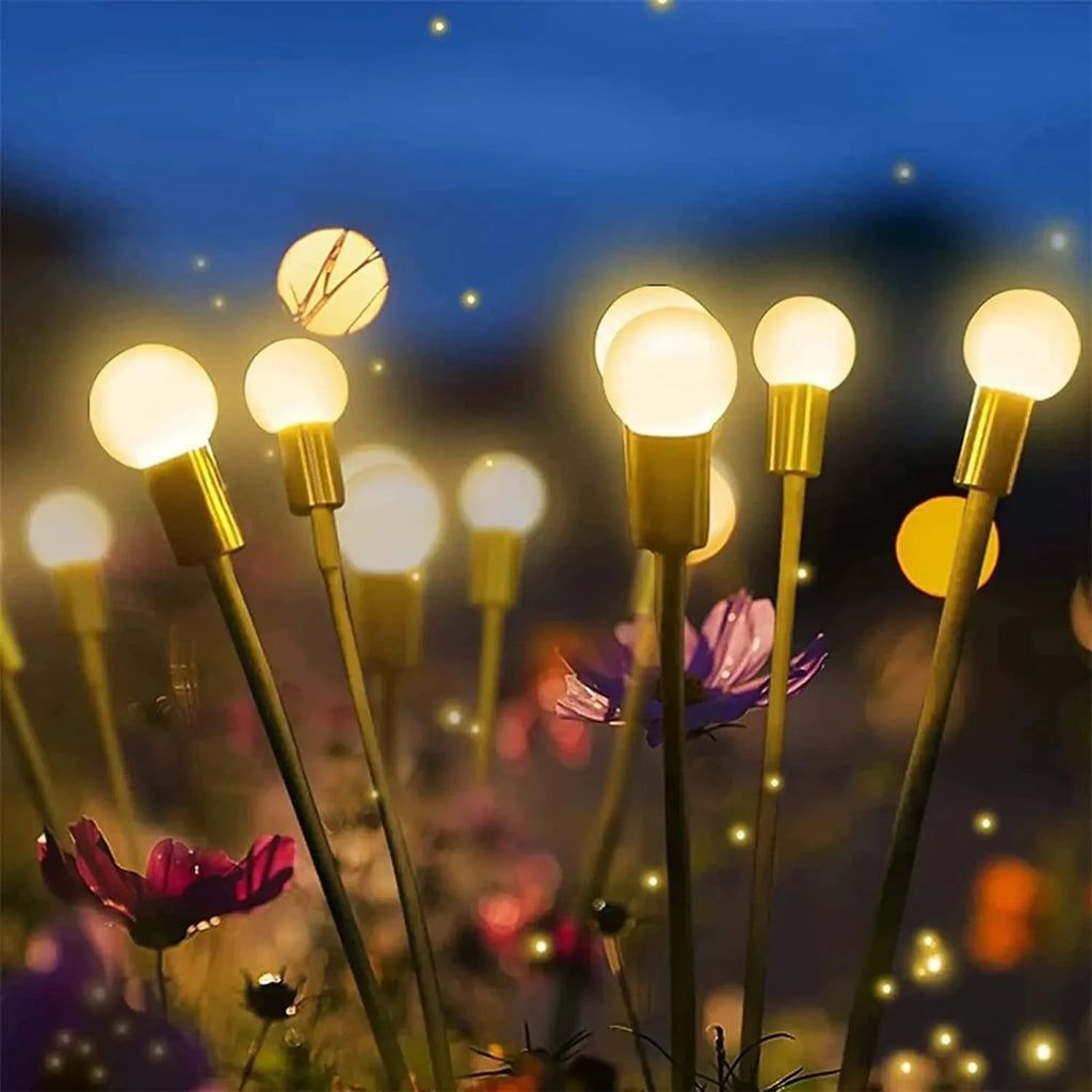 Solar-powered LED garden ground light with multiple light heads and a stainless steel spike for installation.