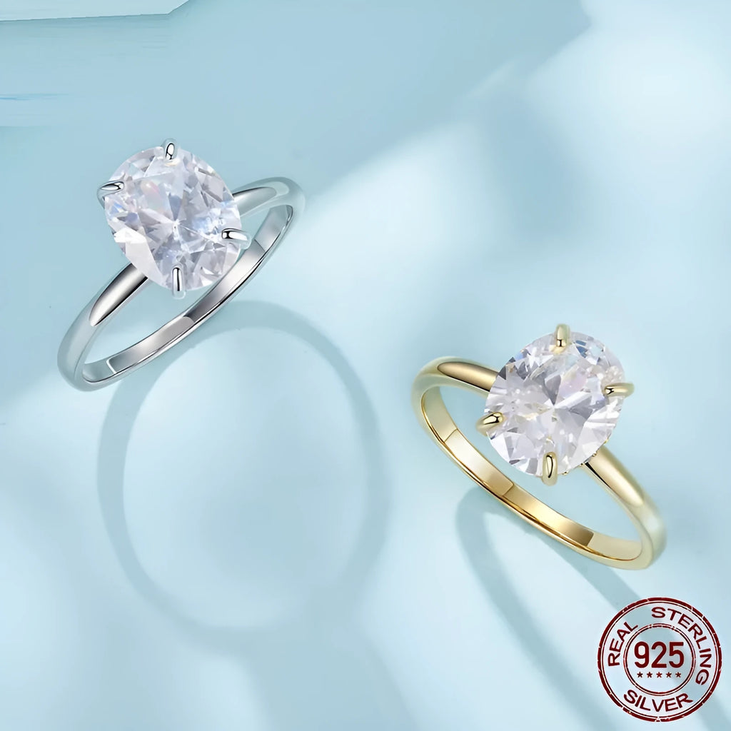 Silver oval cut zircon engagement ring with gold colour electroplating finish on white background