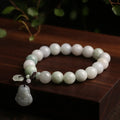 Natural green jade bracelet with geometric links and a carved Maitreya Buddha pendant.