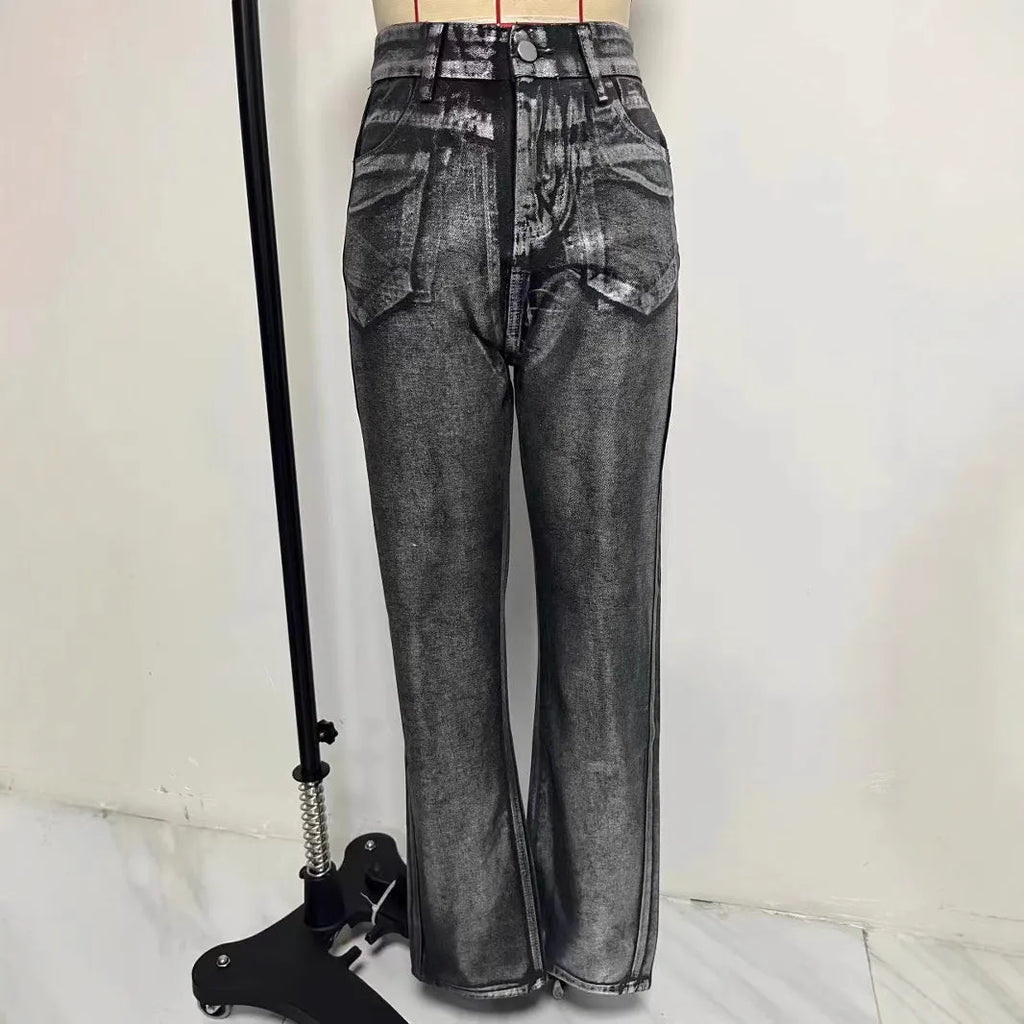 Women's high waist straight leg jeans in washed blue denim with silver contrast details