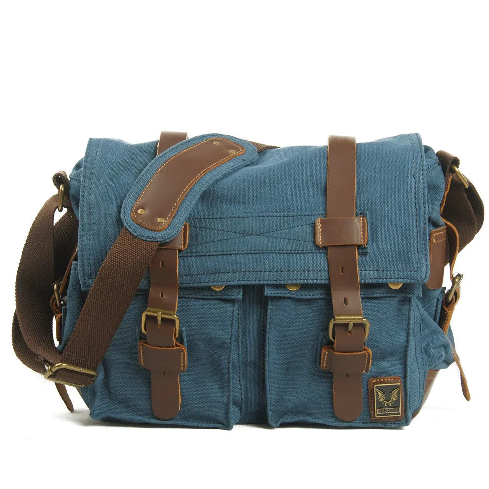 Men's army green canvas crossbody shoulder bag with a brown leather flap and single strap.