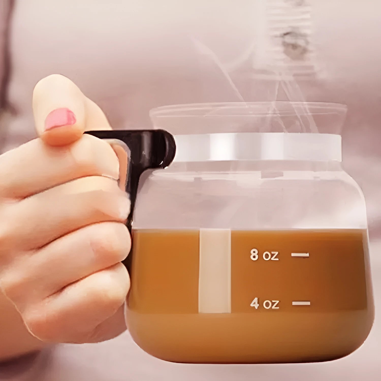 Transparent borosilicate glass coffee maker with silicone cover showing modern design
