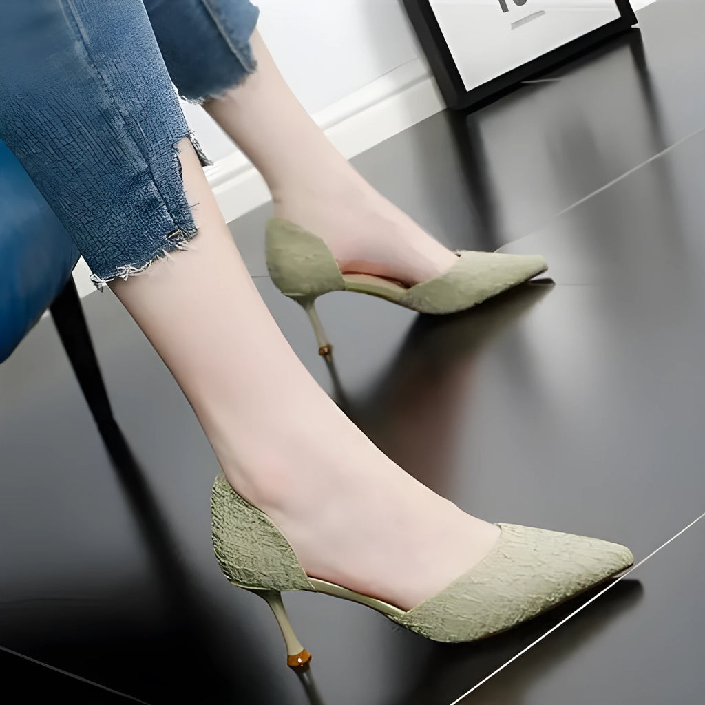 Women's black pointed toe stiletto high heels with a leather upper and thin heel.