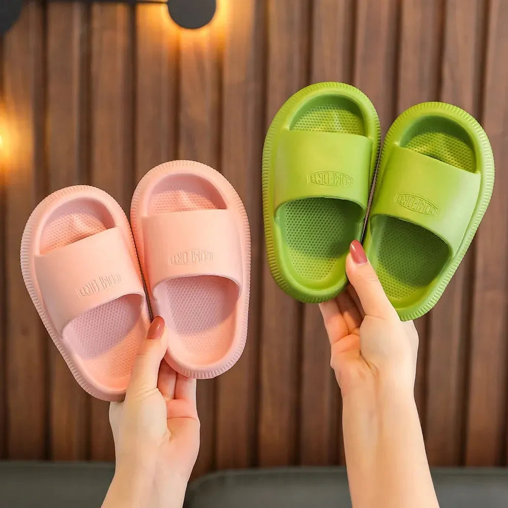 Mixed colour children's EVA slippers with non-slip soles in sizes for ages 24-35.