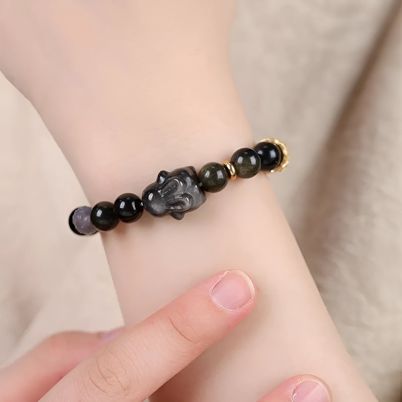 Handmade national style obsidian bracelet with a detailed lying rabbit centrepiece in jin yaoshi and grey agate.