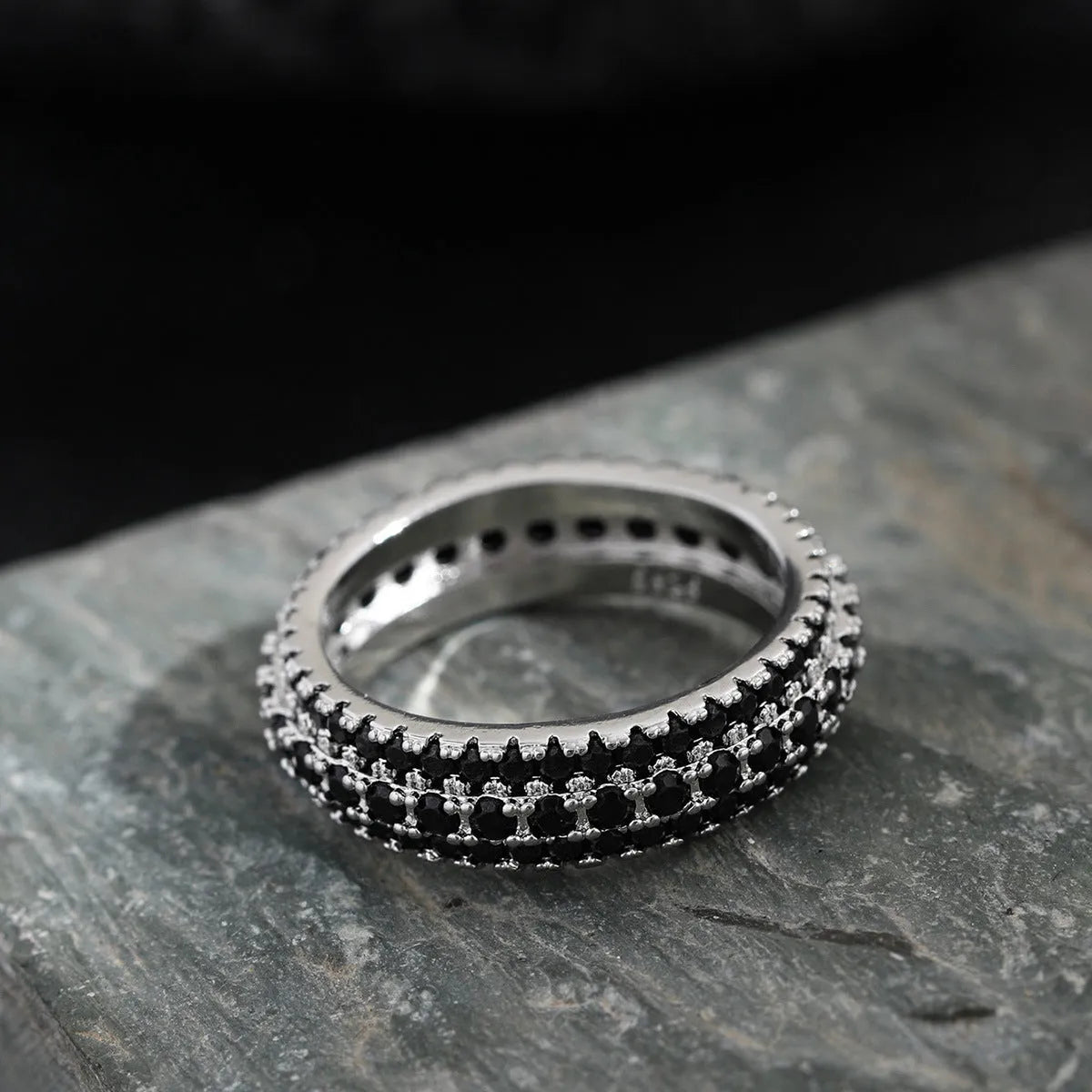 Geometric triangular copper ring with inlaid zircon stones in a choice of three metal finishes.