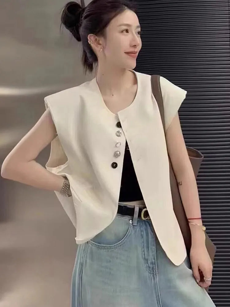 Women's polyester vest in milky white with pocket detail and loose fit design