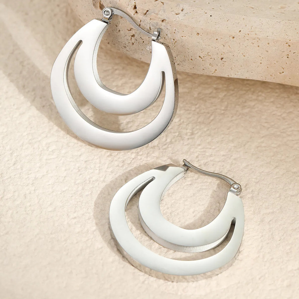 Geometric French earrings gold plated and steel plated minimalist jewellery with round ring elements