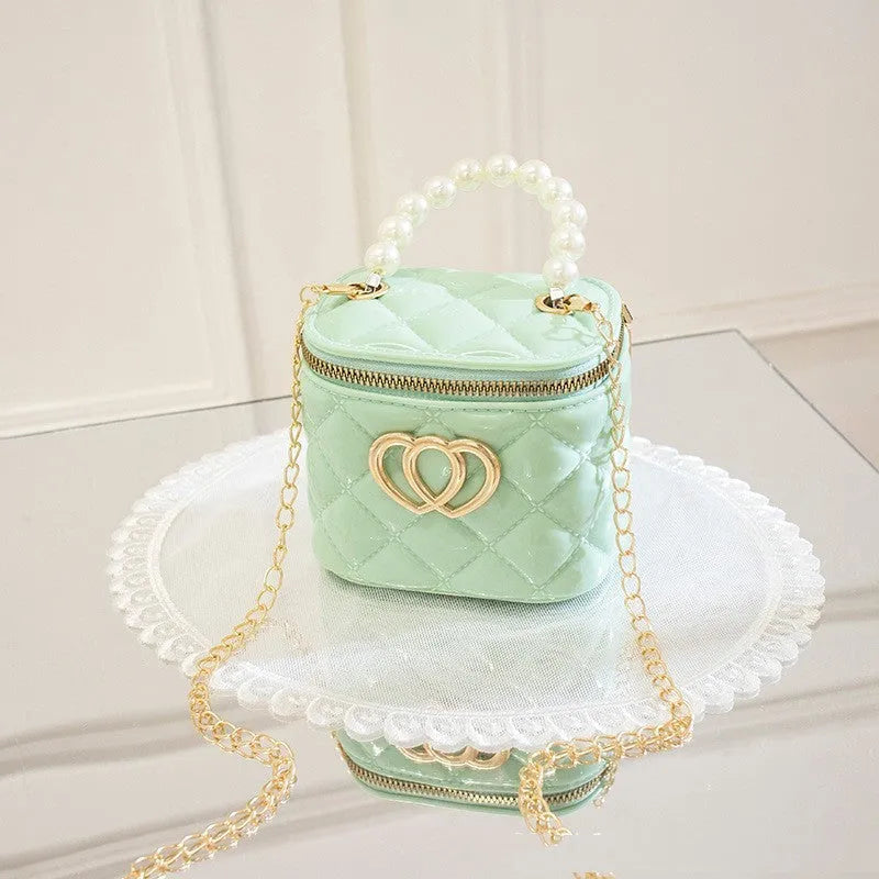 Transparent PVC bucket bag with a heart pattern, shown in one of seven available colours.