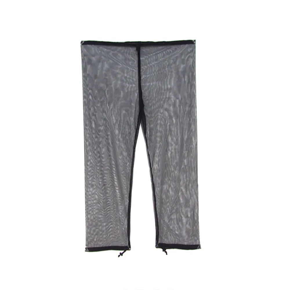 Adult wearing a light grey mesh anti-mosquito suit with hood, full-length pants, and booties for outdoor protection.
