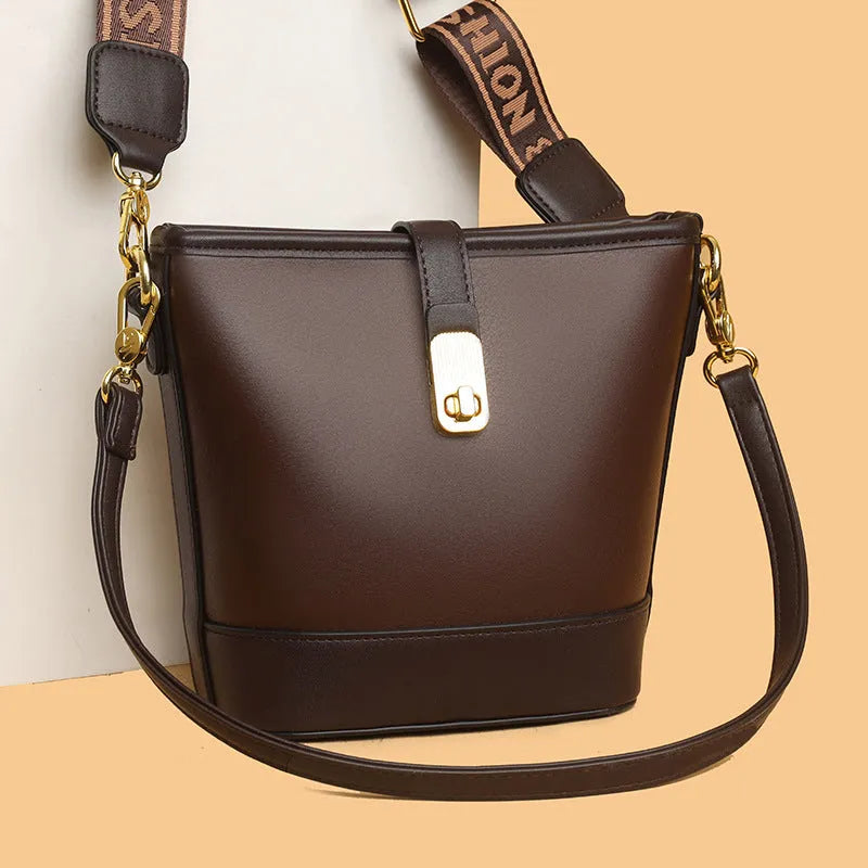 Korean style black bucket messenger bag with adjustable straps and multiple internal compartments