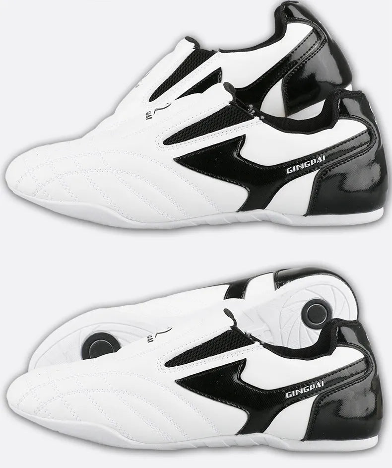 Black and white children's martial arts training shoes with a soft sole and widened design.