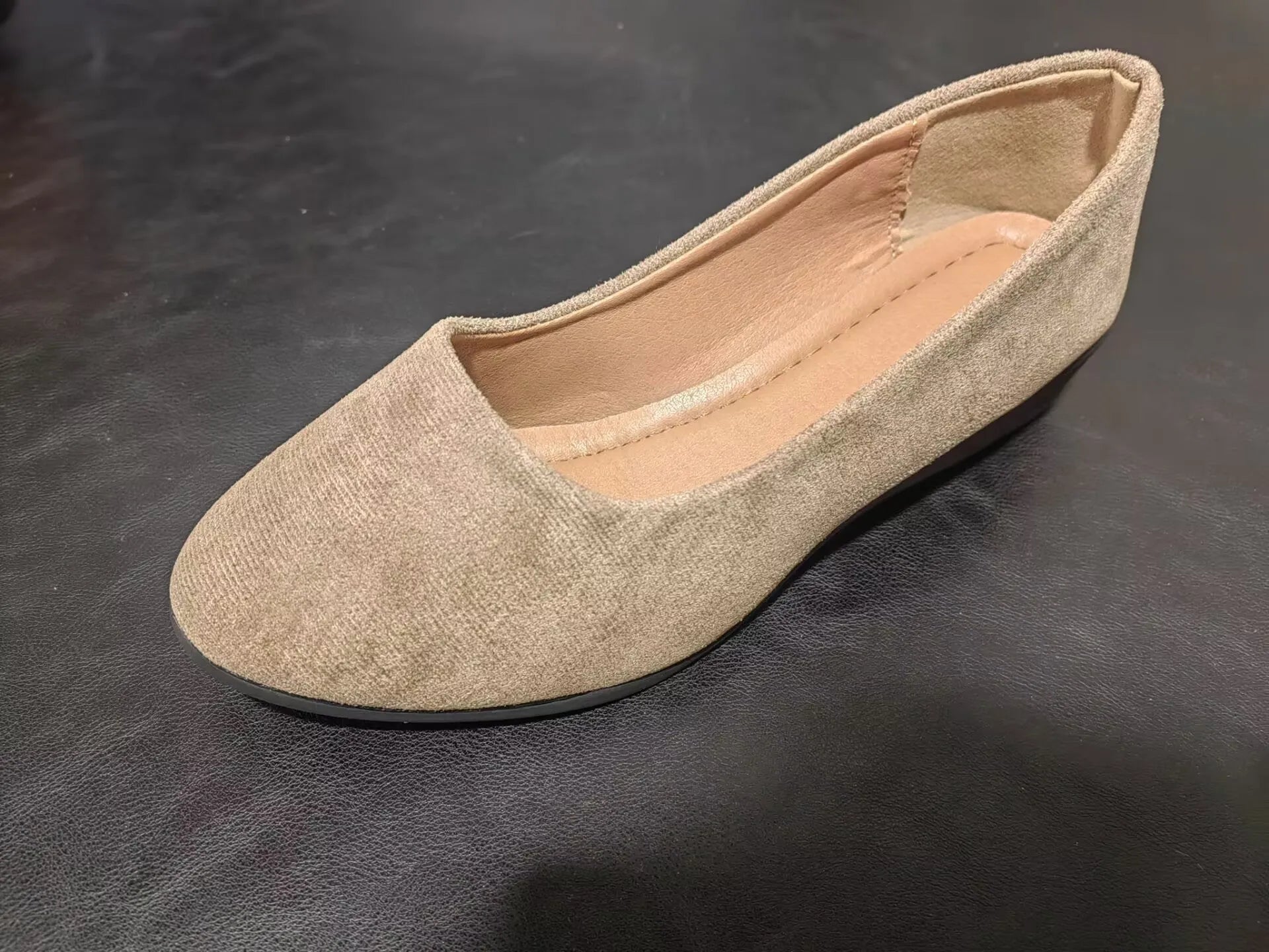 Women's pointed toe wedge pumps in suede with a low heel and shallow mouth opening.