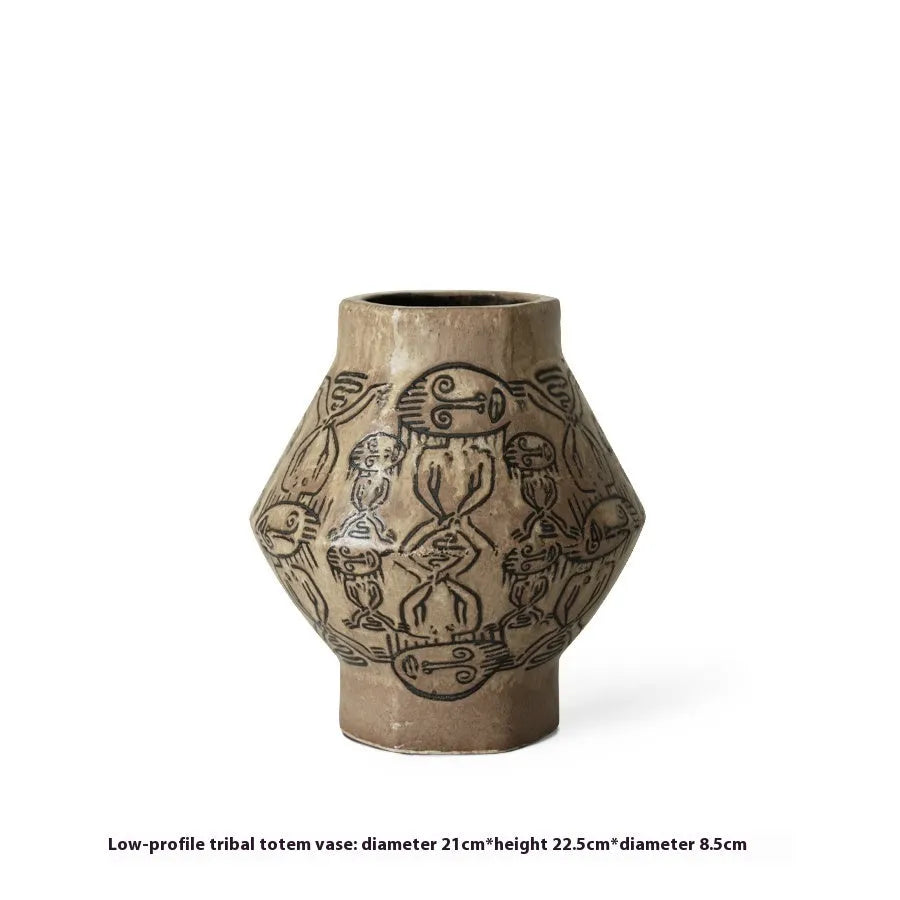 Hand-painted ceramic cylindrical vase with tribal totem patterns in vintage carved style