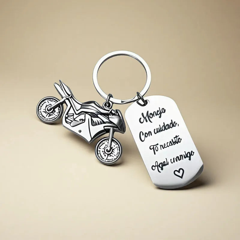 Stainless steel metal keychain on a velvet cloth, showing Motorcycle Keychain and Flannel Bag style options.