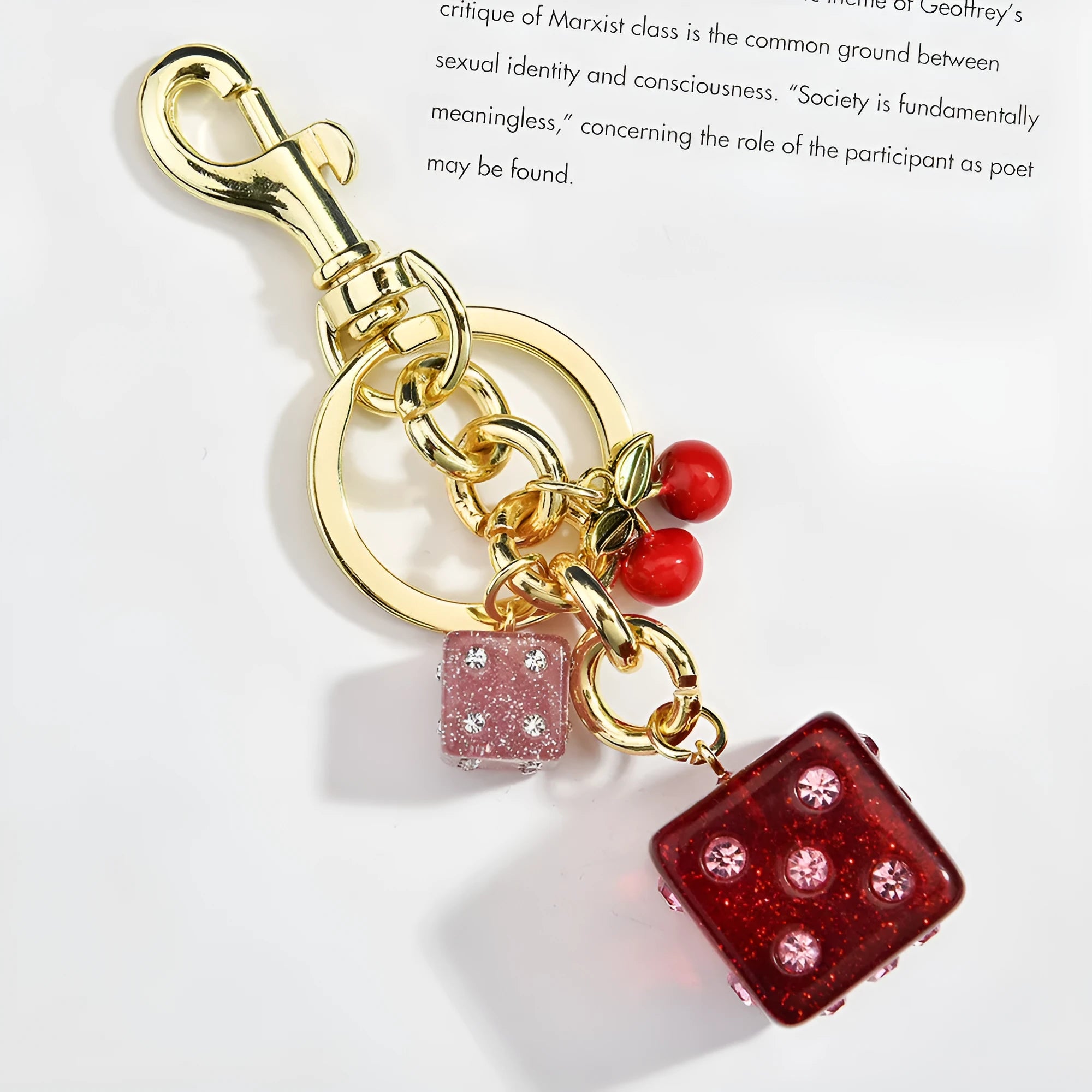 Vintage cherry two-tone square metal dice bag keychain pendant on a keyring.