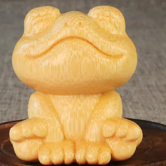 Smiling frog solid bamboo carving ornament measuring 5cm high with cartoon cute style