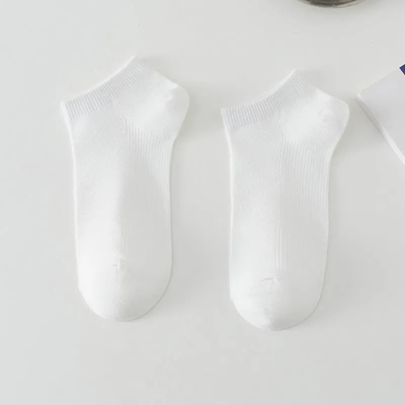 Men's solid colour low-cut polyester boat socks laid flat, showing ankle height and simple design.
