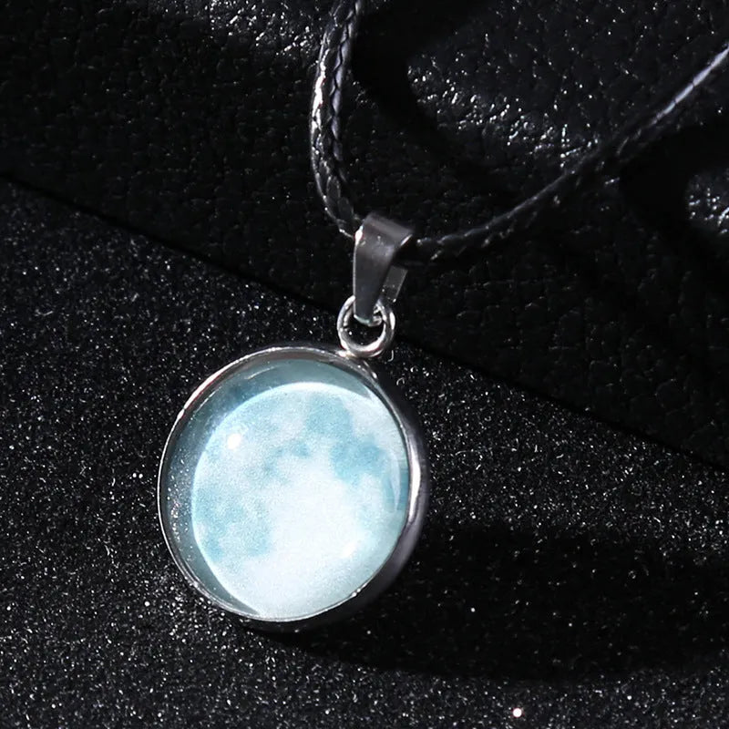Luminous constellation pendant necklace with adjustable chain on a plain background.