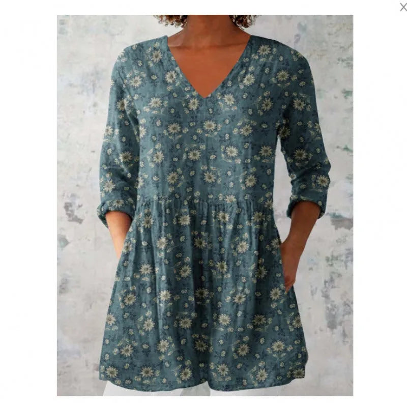 Women's long loose dress with a blue and white wave print pattern, featuring three-quarter sleeves and a wide waist.
