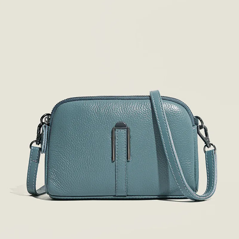 Genuine leather women's square shoulder bag in dark green, showing its horizontal 19x13x6cm shape.