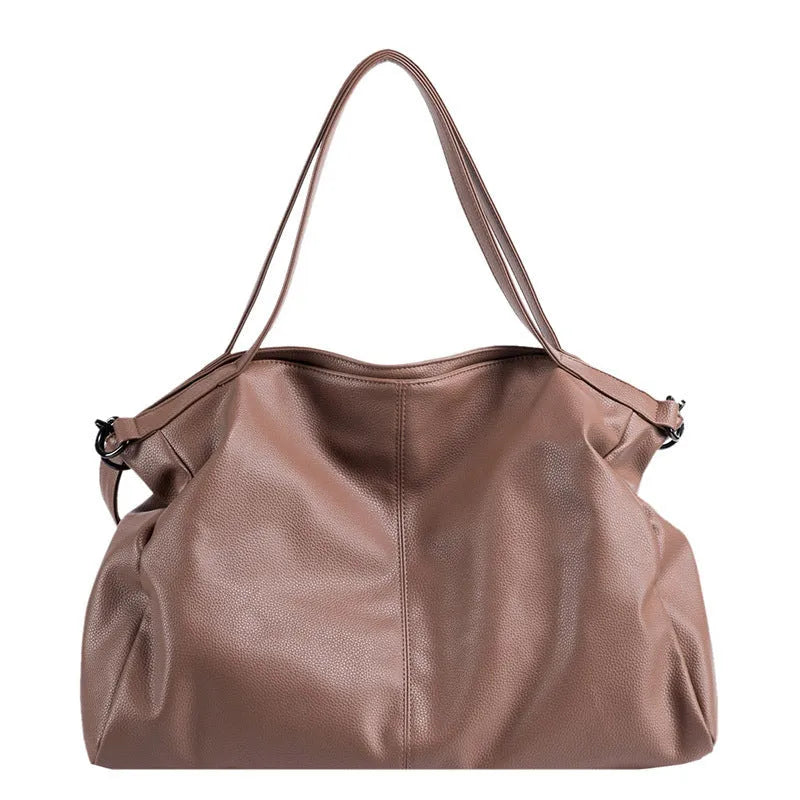 Large soft black PU messenger tote bag with car suture detailing and a long shoulder strap