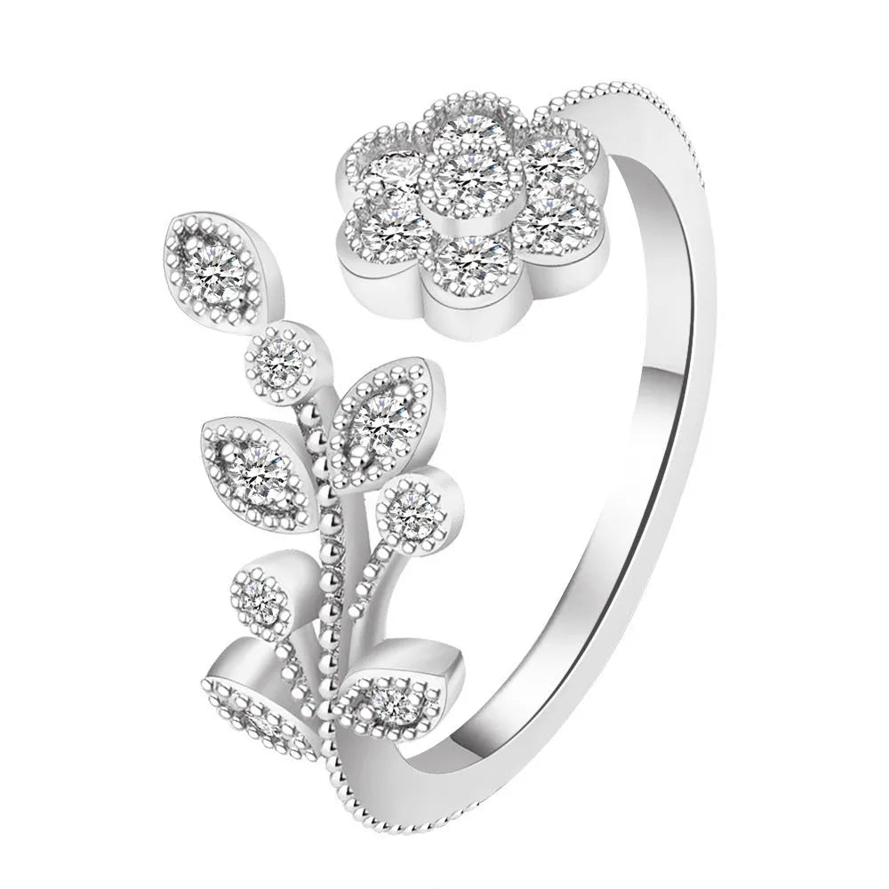 Open mouth copper ring with flower and leaf design in a gold finish