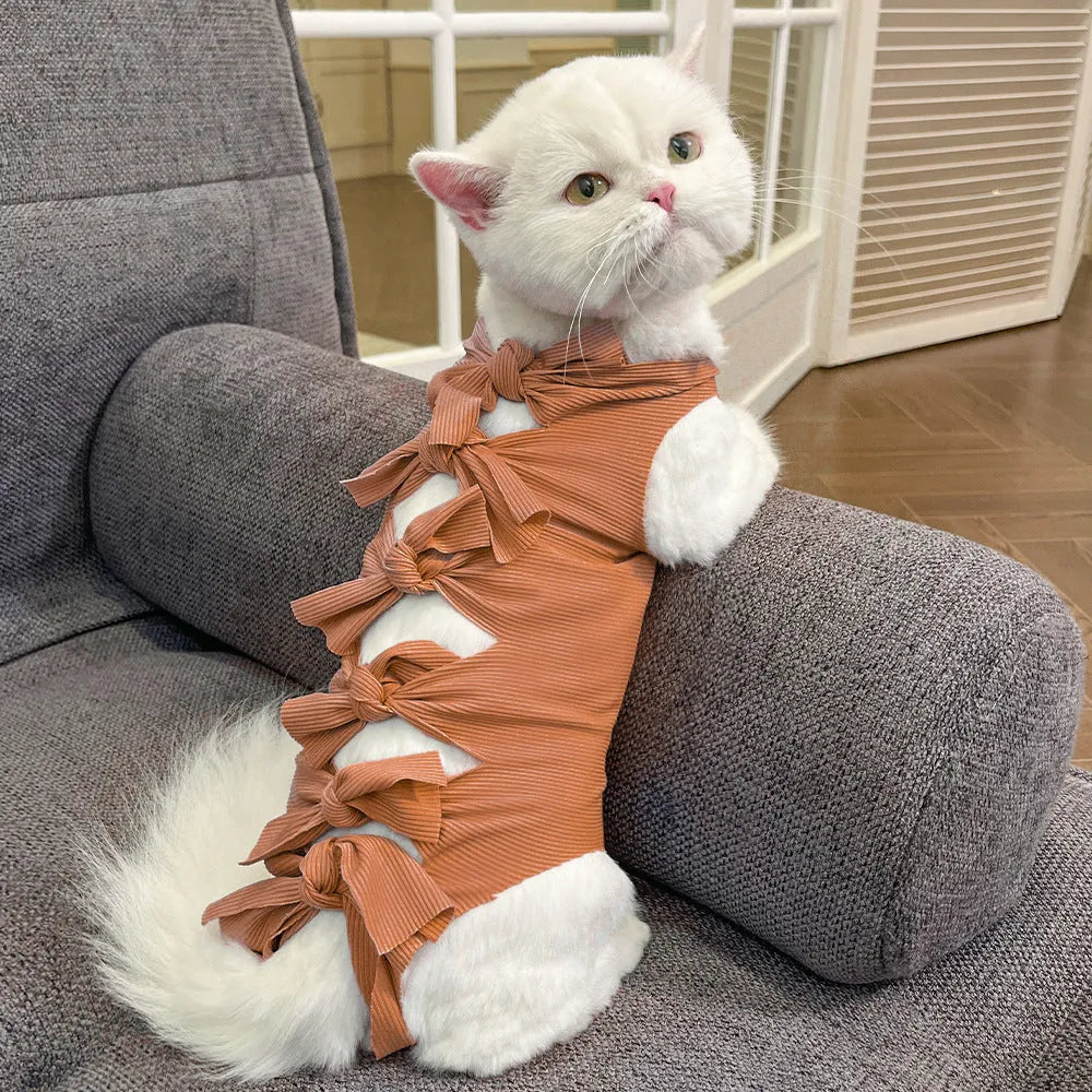 Adjustable lace-up cat sterilisation recovery suit in polyester, shown in various colours.