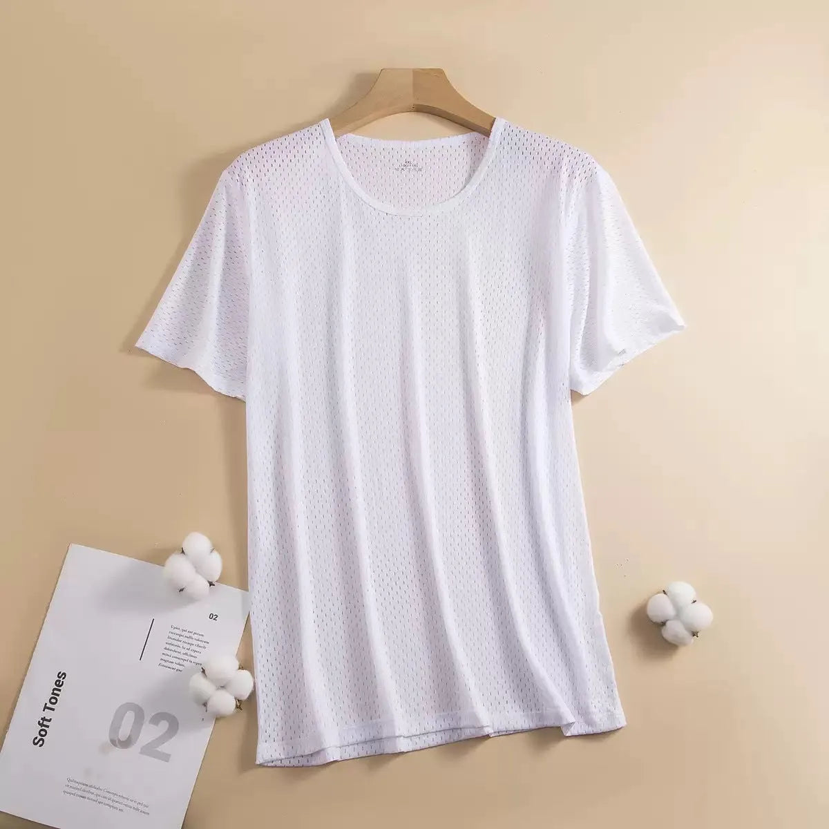 Man wearing a loose-fit grey Ice Silk short sleeve crew neck T-shirt.