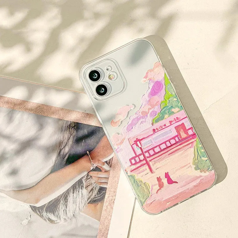 iPhone hard case with a cartoon graphic of two cats printed on the back.