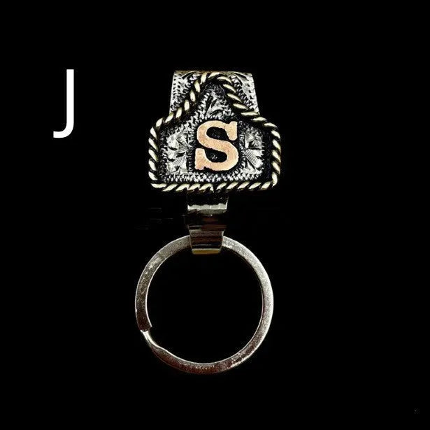 Handmade stainless steel cow tag belt key holder with engraved number plate on a split ring.