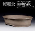 Handmade antique oval bonsai flower pot in purple sand clay, showing dimensions 25cm by 21cm.