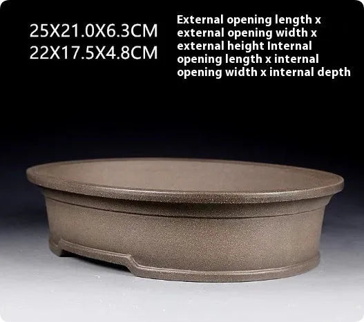 Handmade antique oval bonsai flower pot in purple sand clay, showing dimensions 25cm by 21cm.