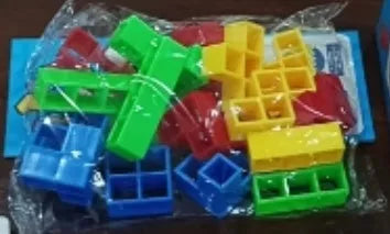 Colourful plastic balance stacking game with blocks, chassis, and base on a table