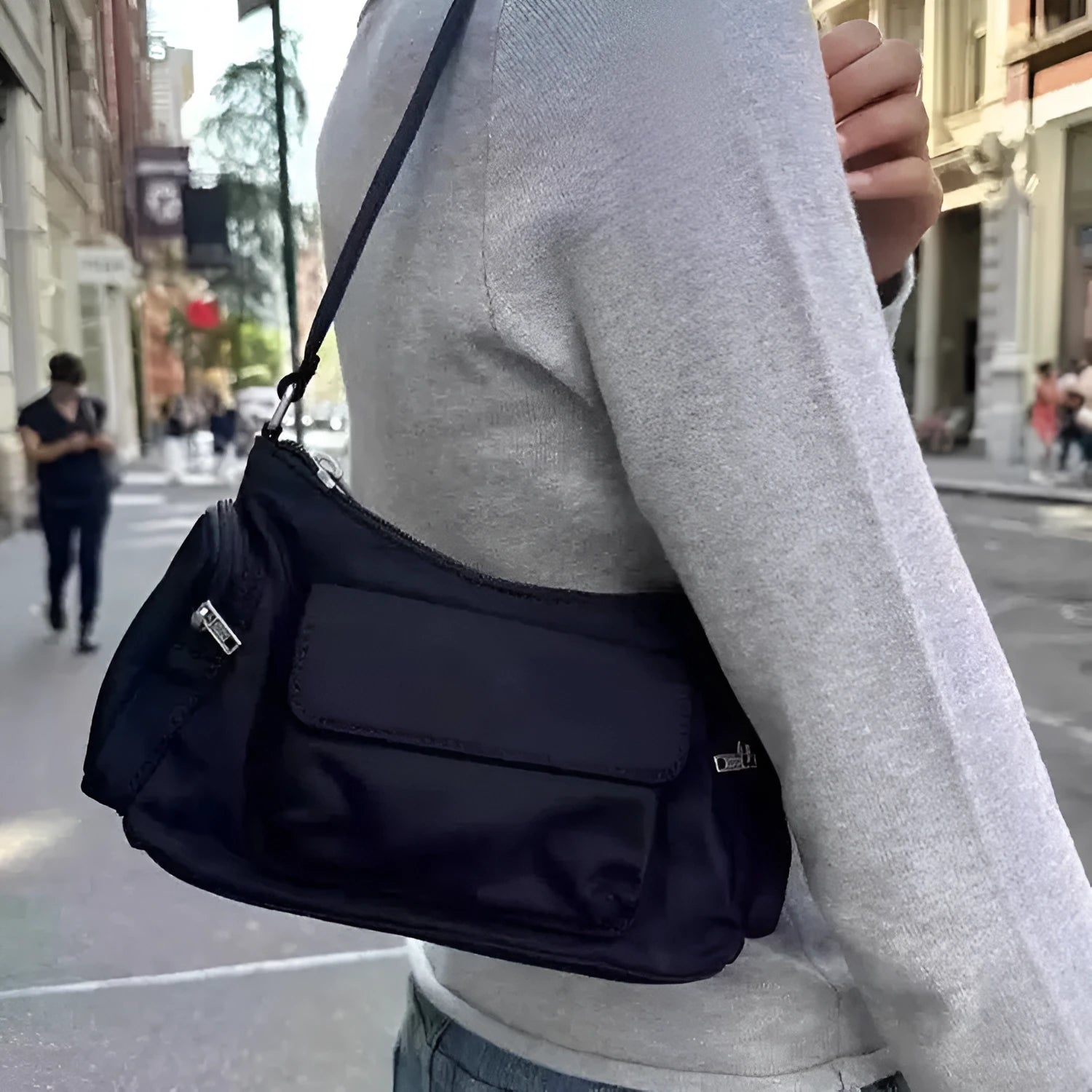 Black lightweight women's shoulder bag with double pockets and side line detailing