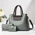 Large PU leather handbag set in horizontal square shape with matching medium and small pouches on white background