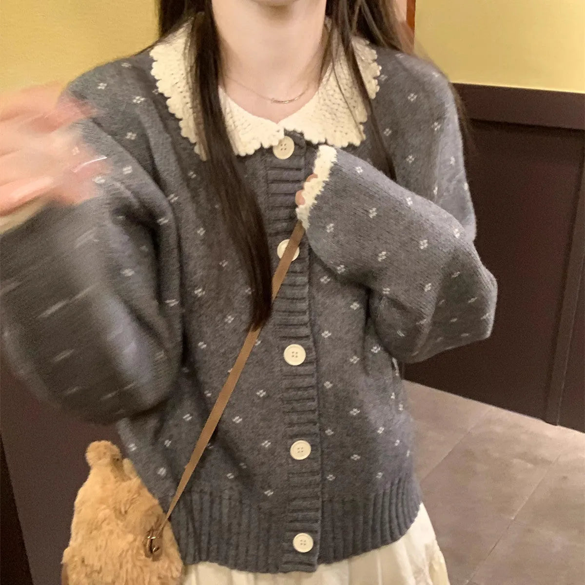 Retro floral patterned knitted cardigan coat with a Peter Pan collar and button front.