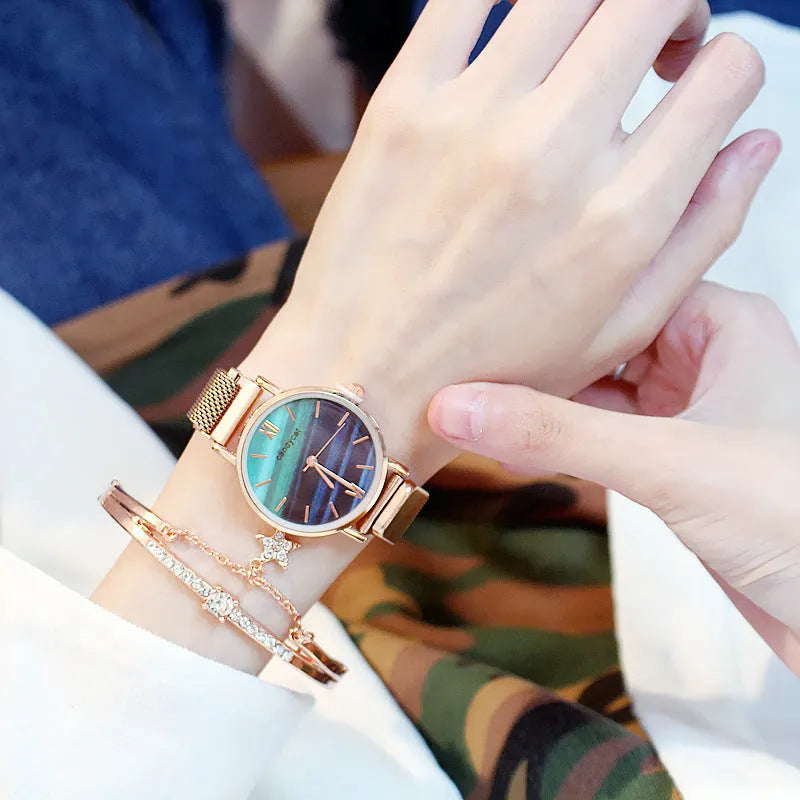 Women's retro marble watch with 32mm round dial, alloy strap, and titanium case back on white background