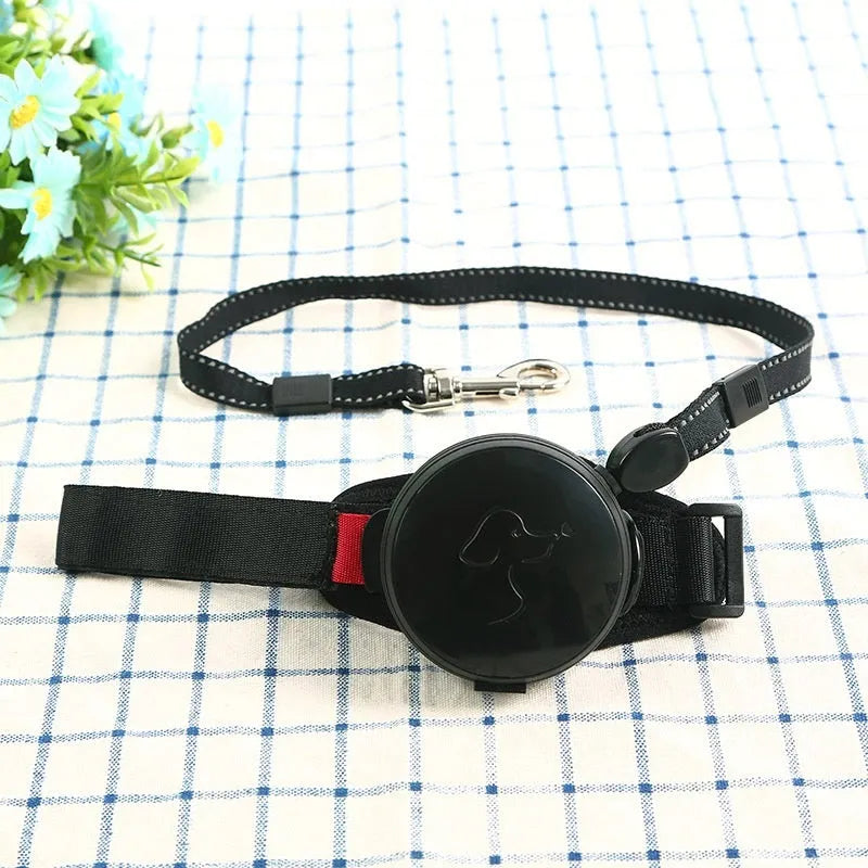 Automatic retractable dog leash extended to 3 metres, shown in vibrant orange colour with ergonomic handle.