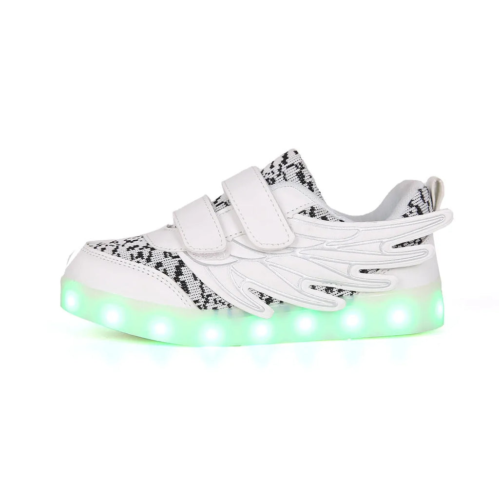 Plum red and white children's LED light-up sneakers showing USB charging port and hidden colour-selector switch.
