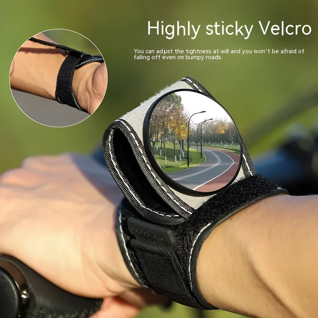 Black nylon wrist-mounted rear-view mirror for cyclists and motorcyclists on a textured background.