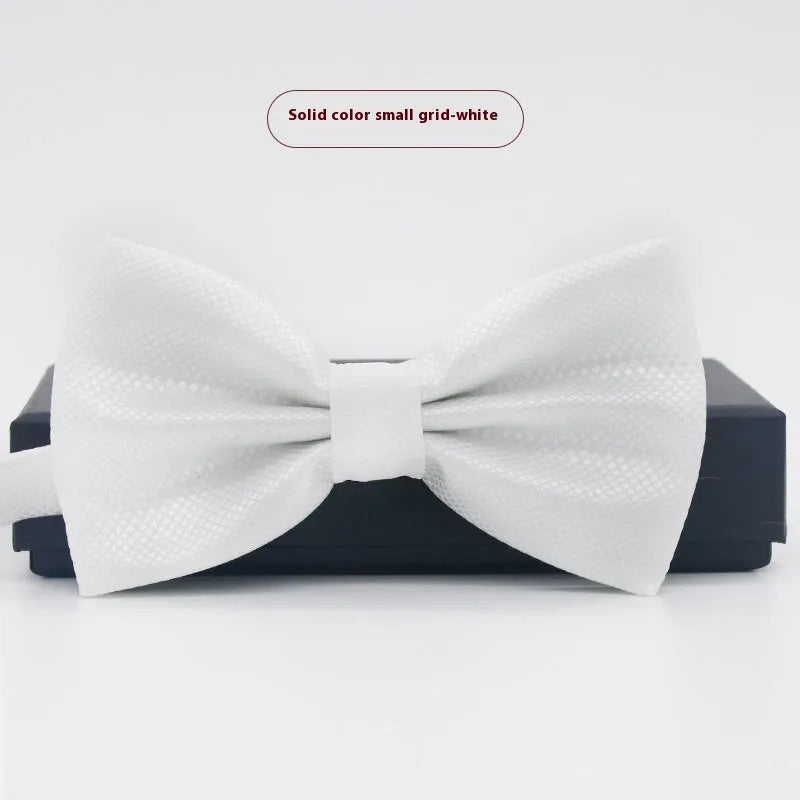 Men's flat head style polyester bow tie in a solid colour, shown with adjustable neck strap.