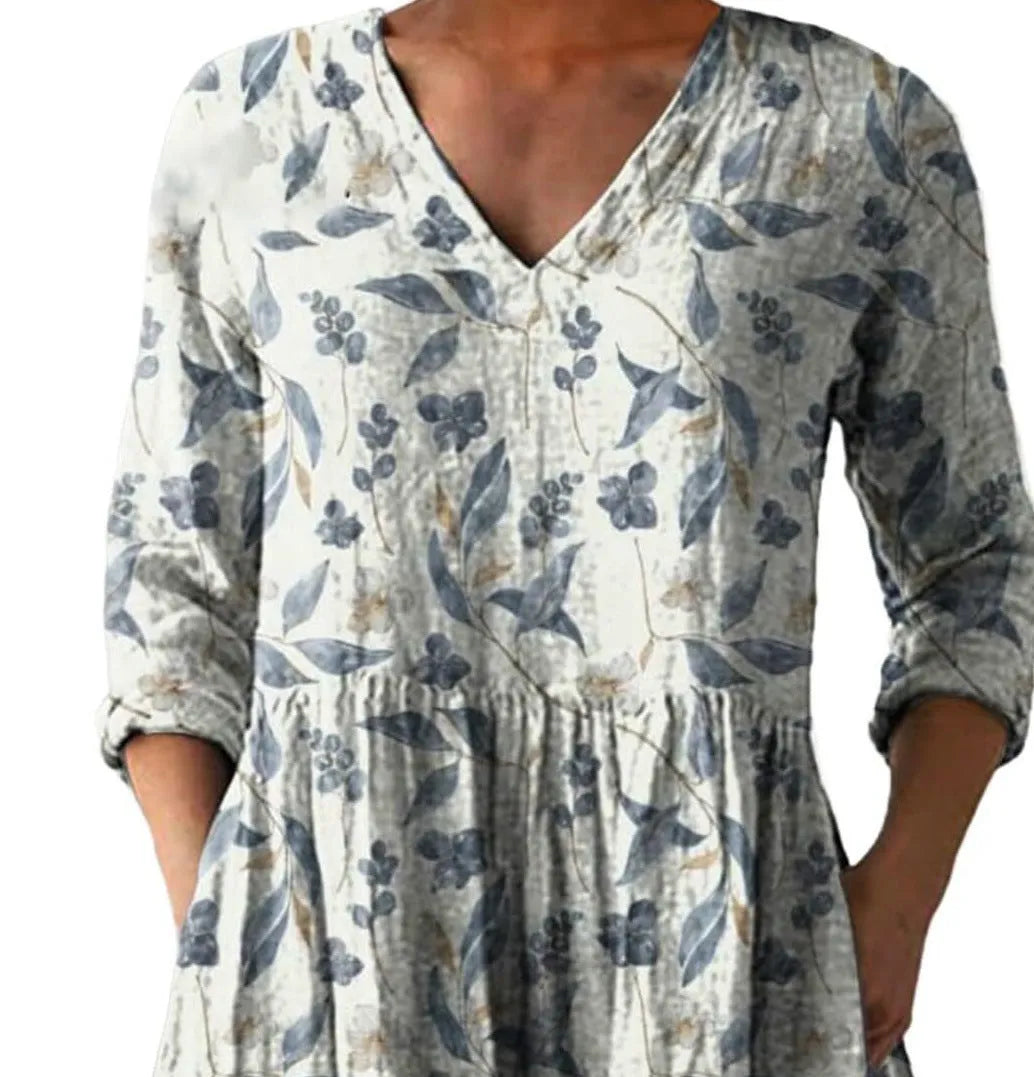 Women's long loose dress with a blue and white wave print pattern, featuring three-quarter sleeves and a wide waist.