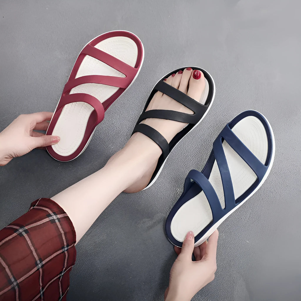 Women's solid-colour summer sandals in breathable PP material, shown in red, purple, blue, black, gray, or pink.