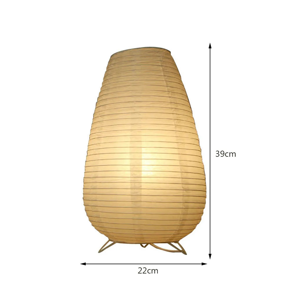 Small white table lamp with rice paper shade on bedside table, circular shape, traditional handwork
