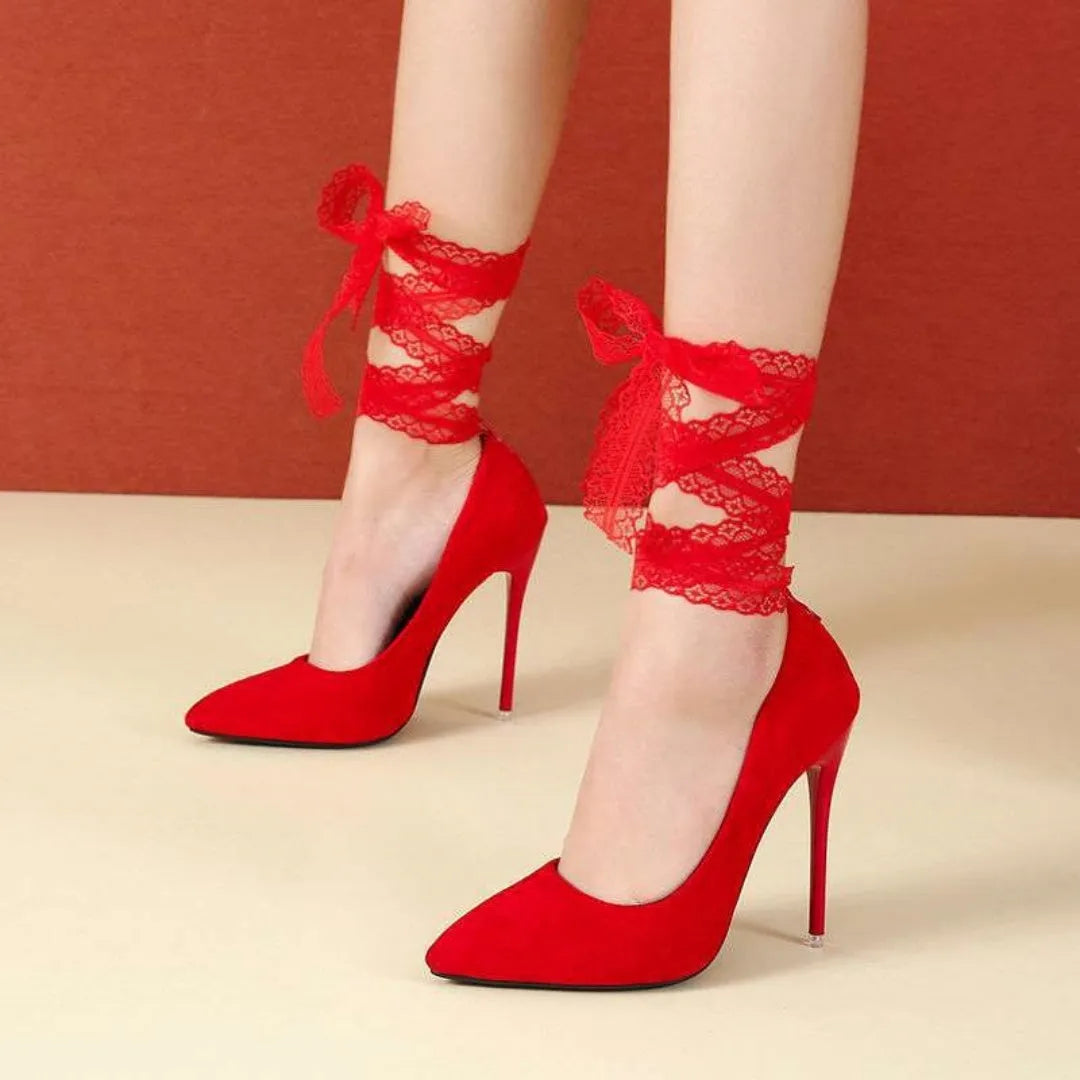 Black women's stiletto pump with thin lace strap and pointed toe on a 12cm heel.