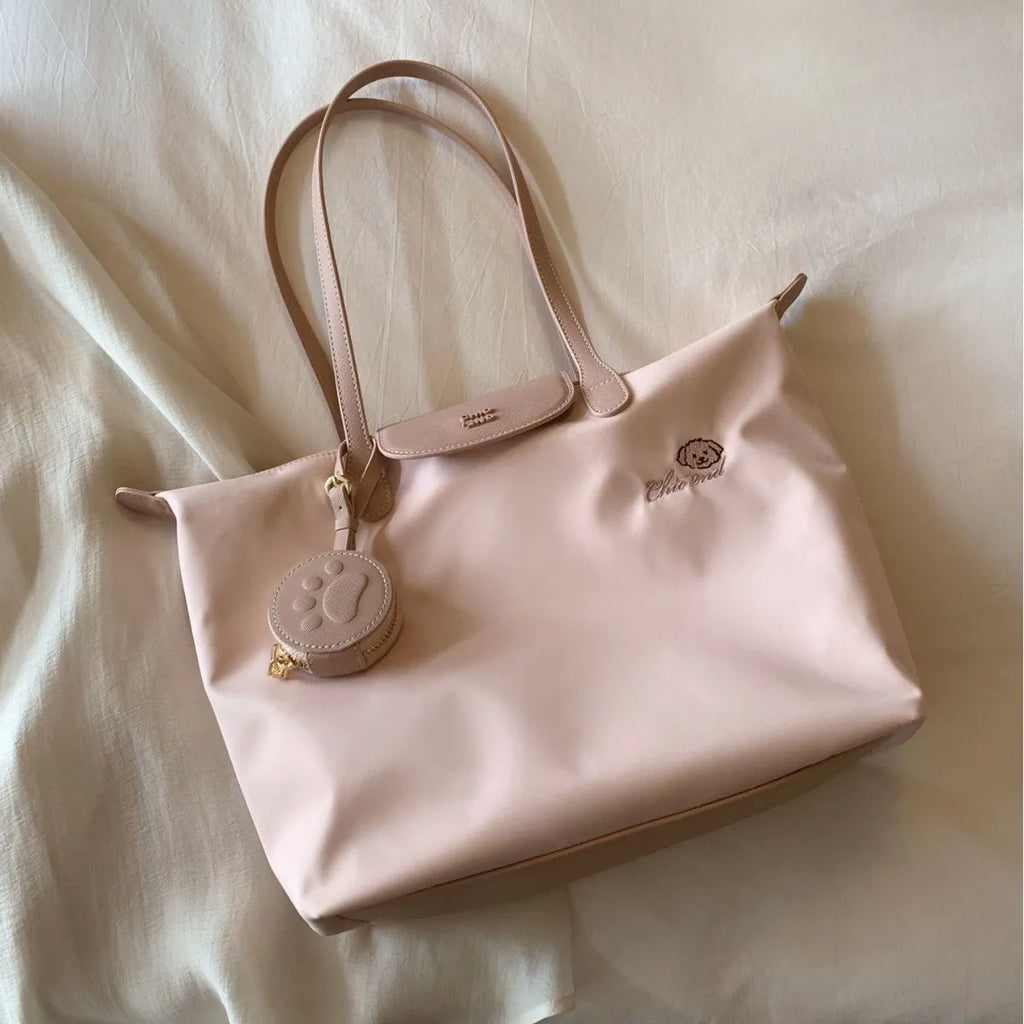 Oxford cloth tote shoulder bag in pink colour with sandwich pocket design and crossbody strap