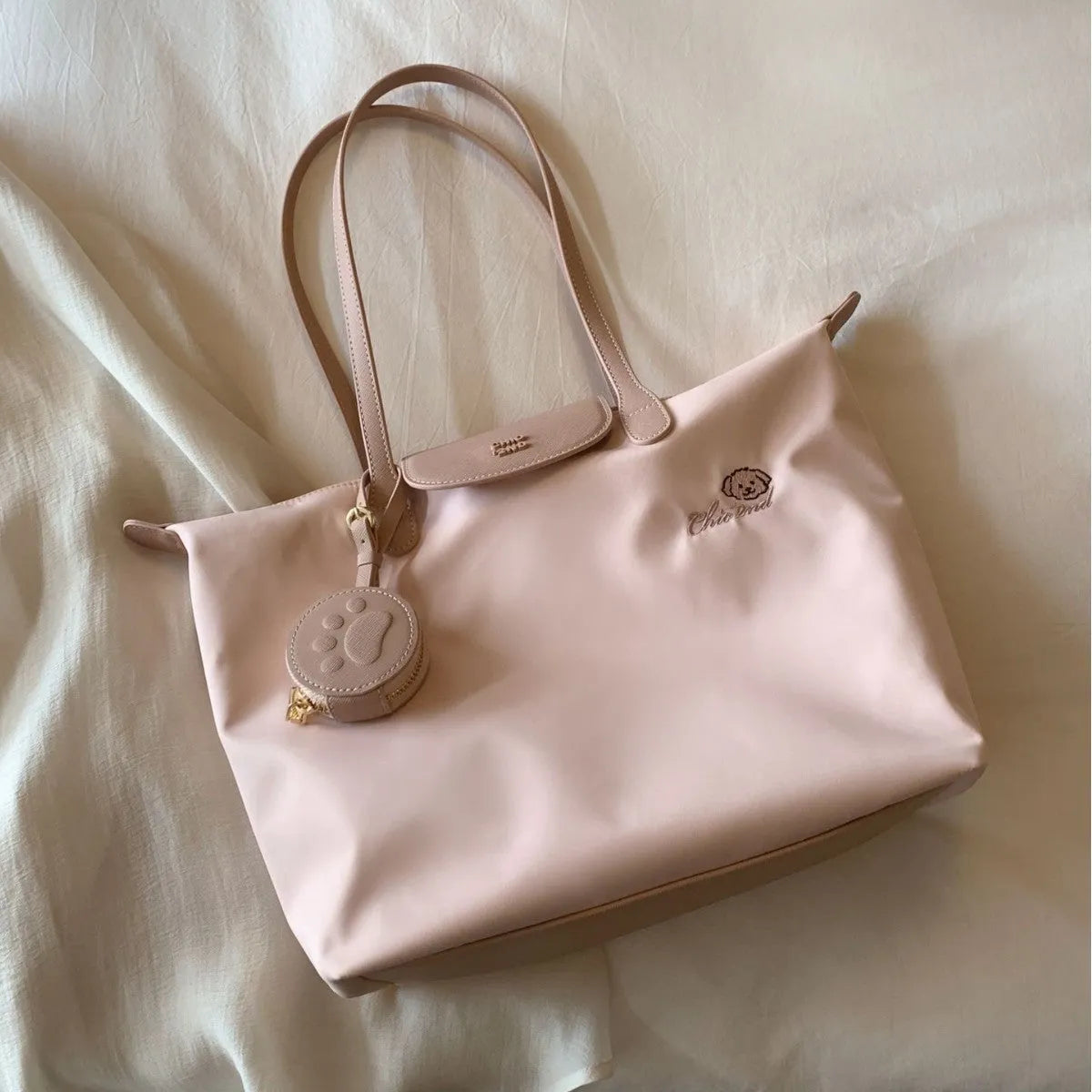 Oxford cloth tote shoulder bag in pink colour with sandwich pocket design and crossbody strap