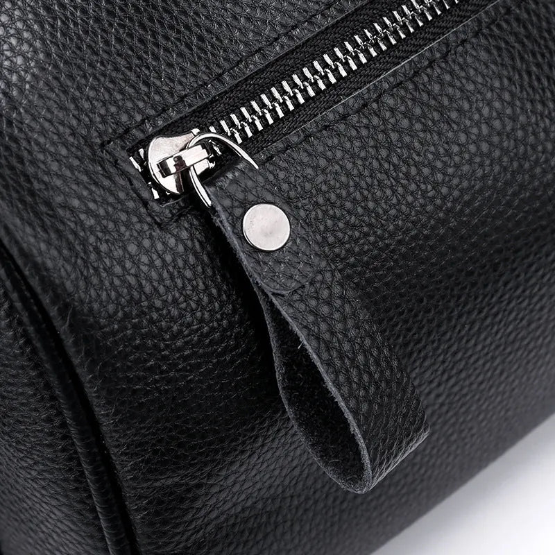 Black genuine leather crossbody shoulder bag showing 24cm height with polyester lining