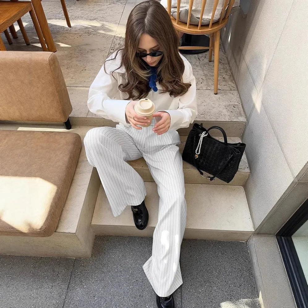 White striped loose fit wide-leg commuter trousers with zip fastening